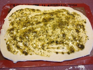 Spread the herb mixture over the dough